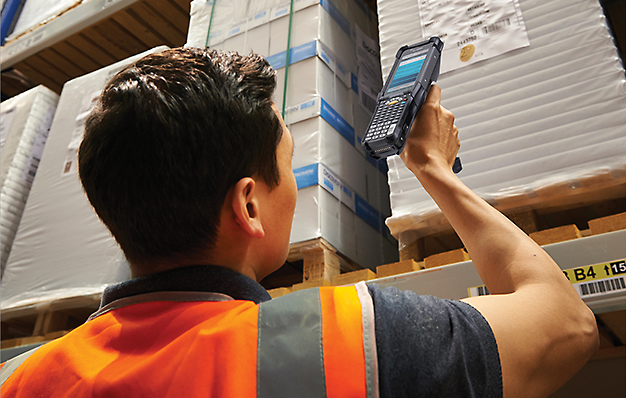 Worker using technology in Warehouse